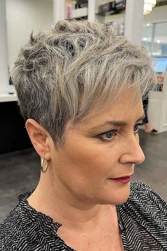 Blonde grey textured pixie, piecey layers, three-quarter view for women over 60
