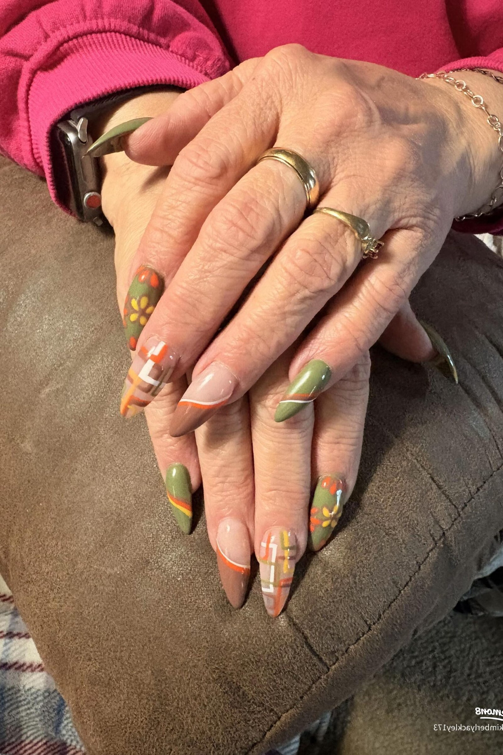 Nude with olive green and orange fall leaf art, almond shape, medium length, glossy, older hands, fall nail color for women over 40