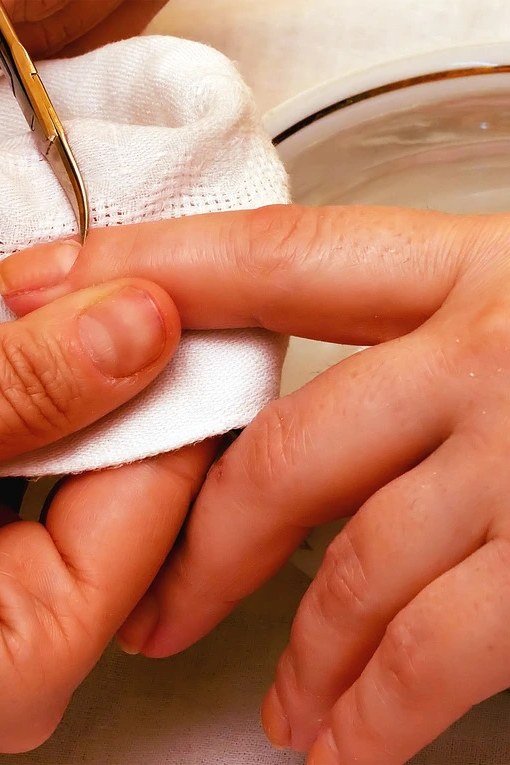 Exfoliating mature hands during a weekly hand care routine