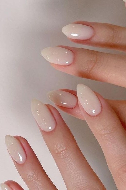 Milky nude almond nails, sophisticated nail design for women over 50
