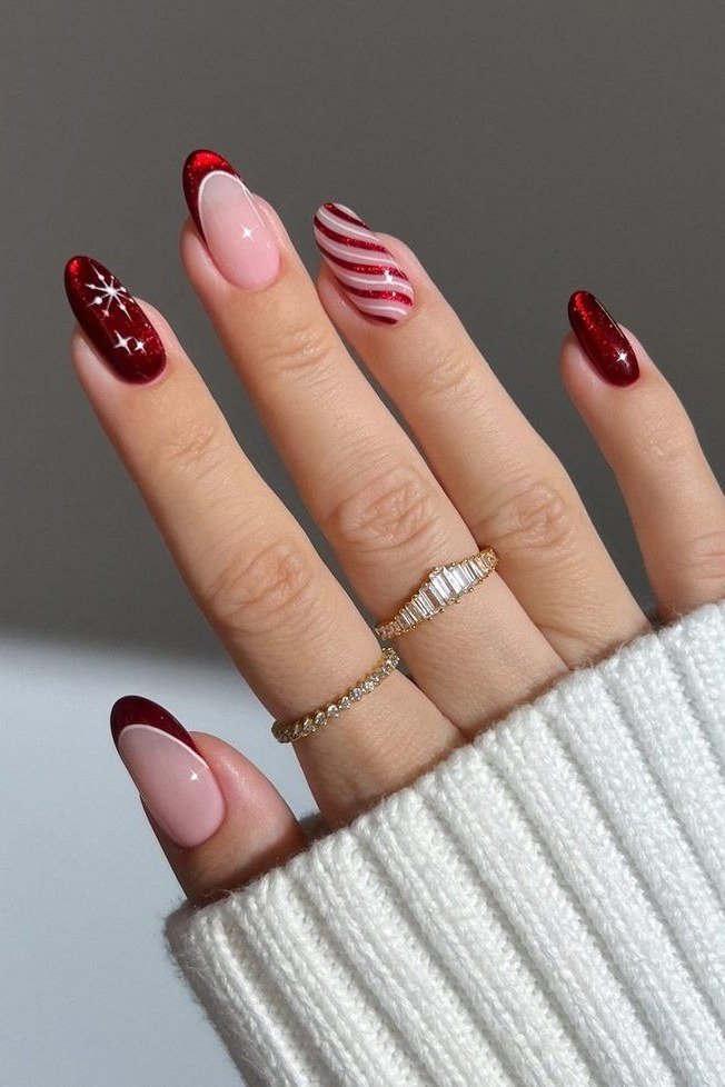 nude nails with single candy cane stripe accent