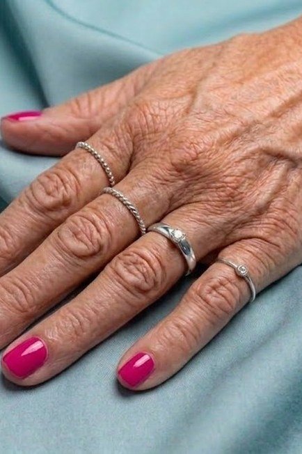 Hot pink nails on older hands, best manicure idea for women over 60