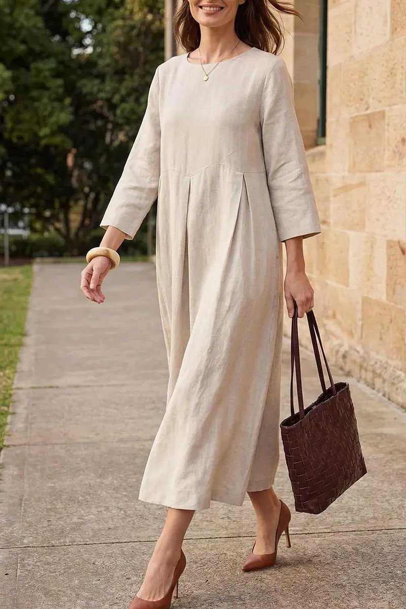 Sand long-sleeve midi dress with dark leather tote, garden walk for women over 60