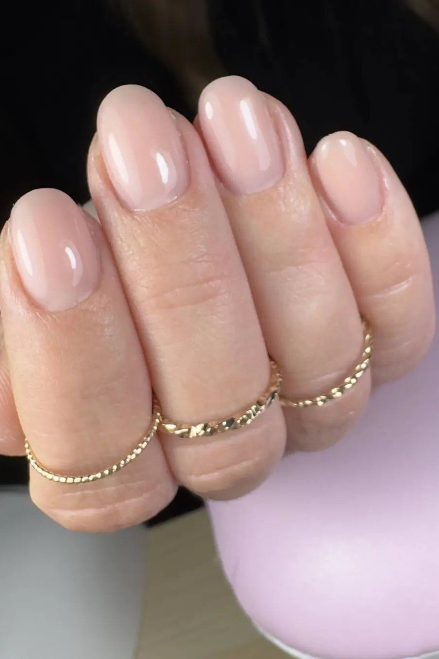 Pearly Pink Nude with Gold Rings - short nude nail idea for women over 50