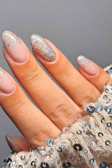Nail art design for women over 60: silver glitter ombre nails with sequin sleeve