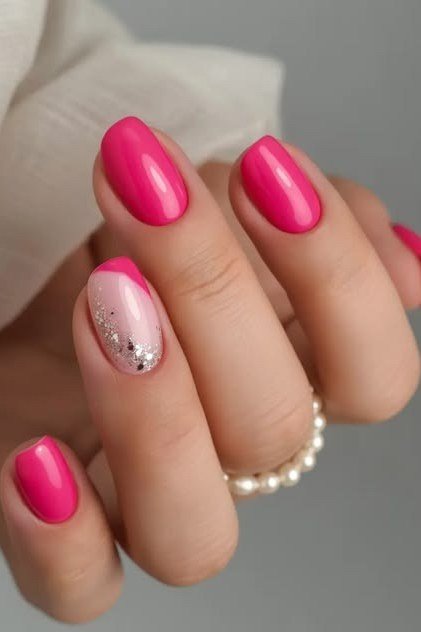 hot pink nails with silver glitter accent nail