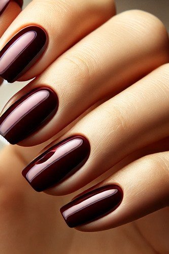 Deep plum glossy nail polish