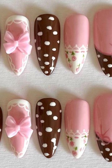 Pink and brown spotted press-on nail set with pink bows fall design