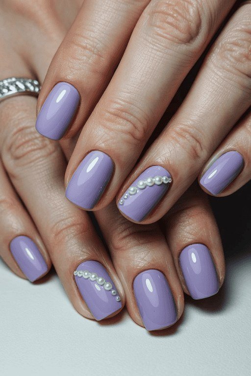 Lavender gel nails with pearls for mature hands