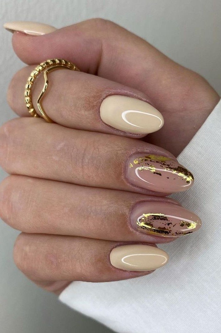 29. Cream Nails With Gold Foil Accents - Thanksgiving nail art idea for women over 50