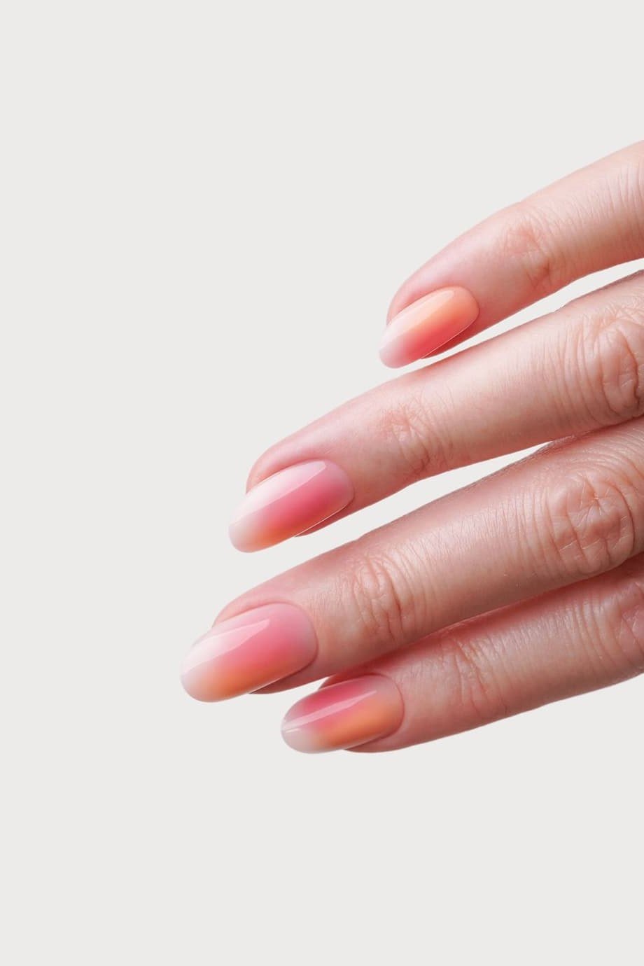 Minimal Pink Ombre on Oval Nails - Barely there pink fades across these short oval nails with a clean, natural shine.