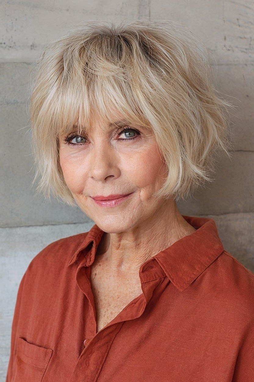 White bob shag haircut with coral top for women over 60