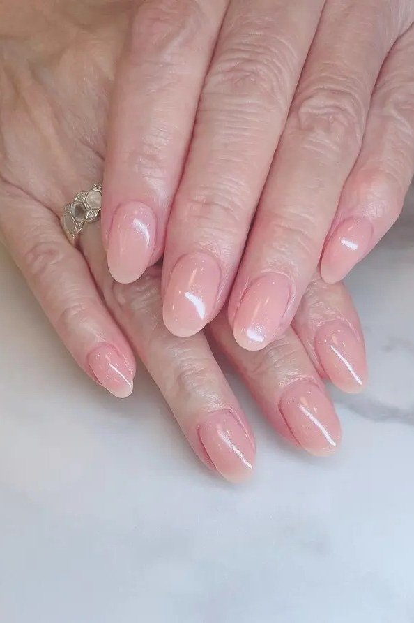 Soft Pink Gel Nails - short gel nail idea for women over 50