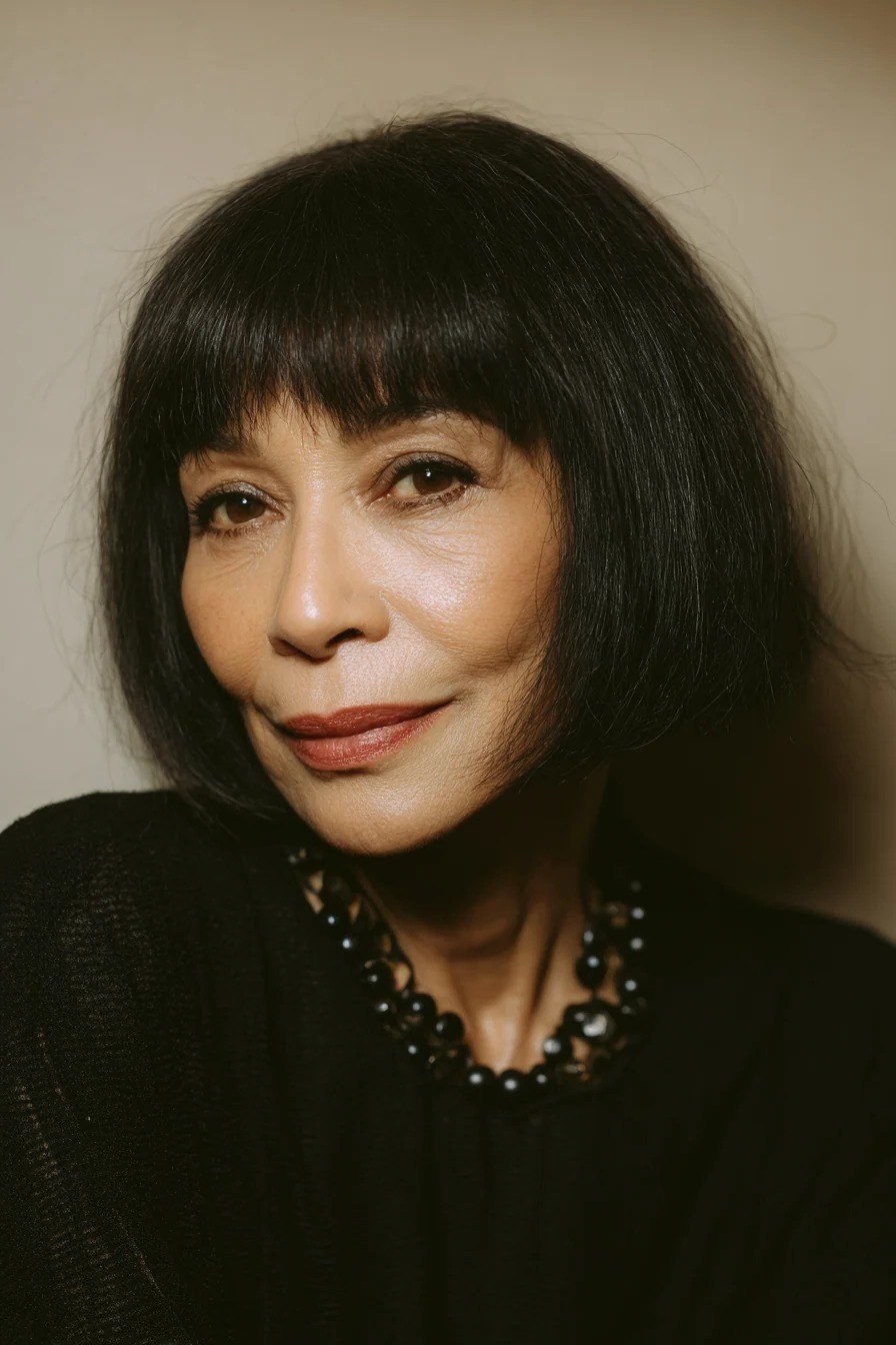 Bold black bob with full bangs for women over 60