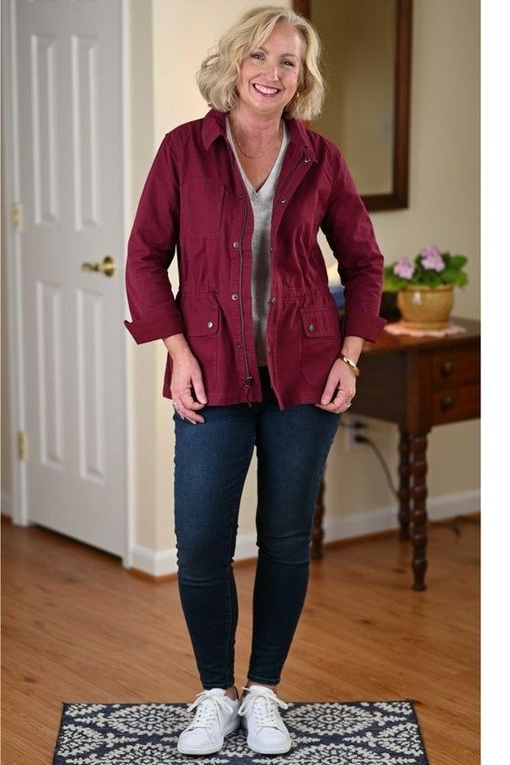 Burgundy utility jacket with dark skinny jeans and white sneakers