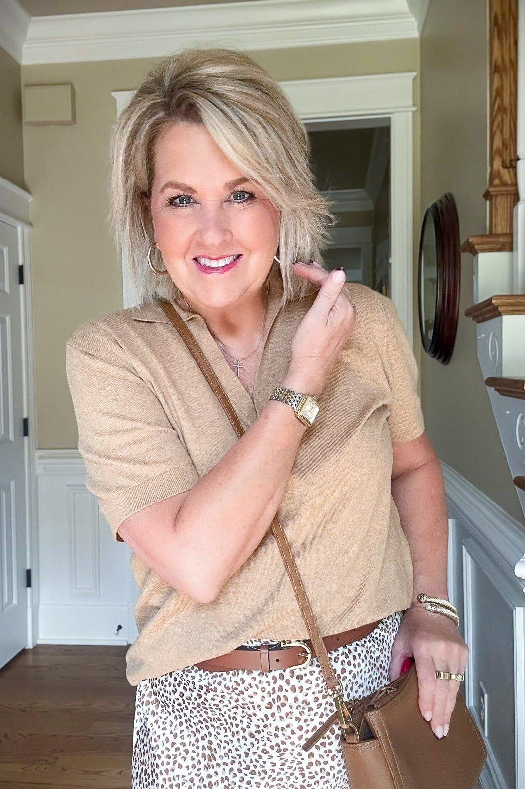 Beige short-sleeve top with animal-print midi skirt for women over 50, fall date night outfit