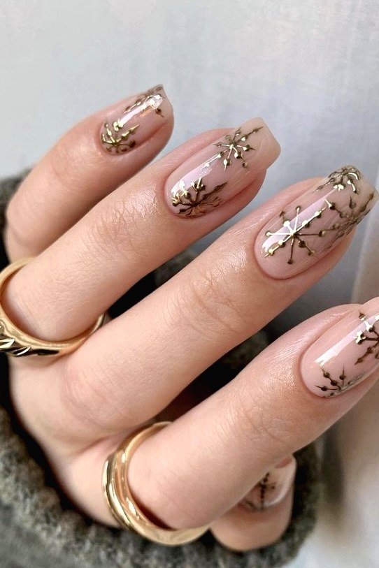 Nude with gold snowflake and branch line art - Christmas nail design for older women