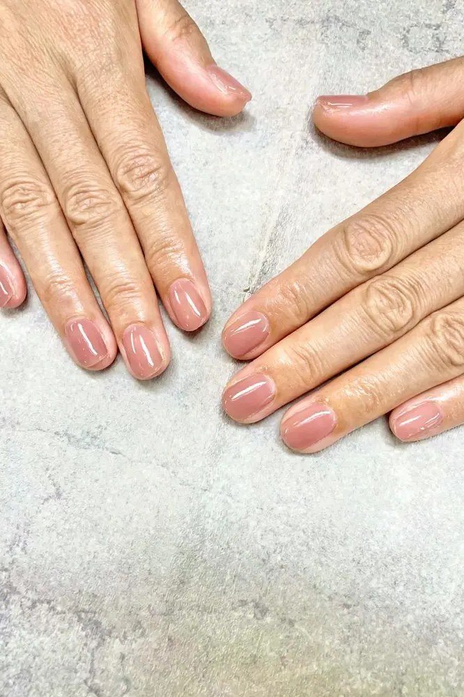 Pink ombre gel nails for mature hands