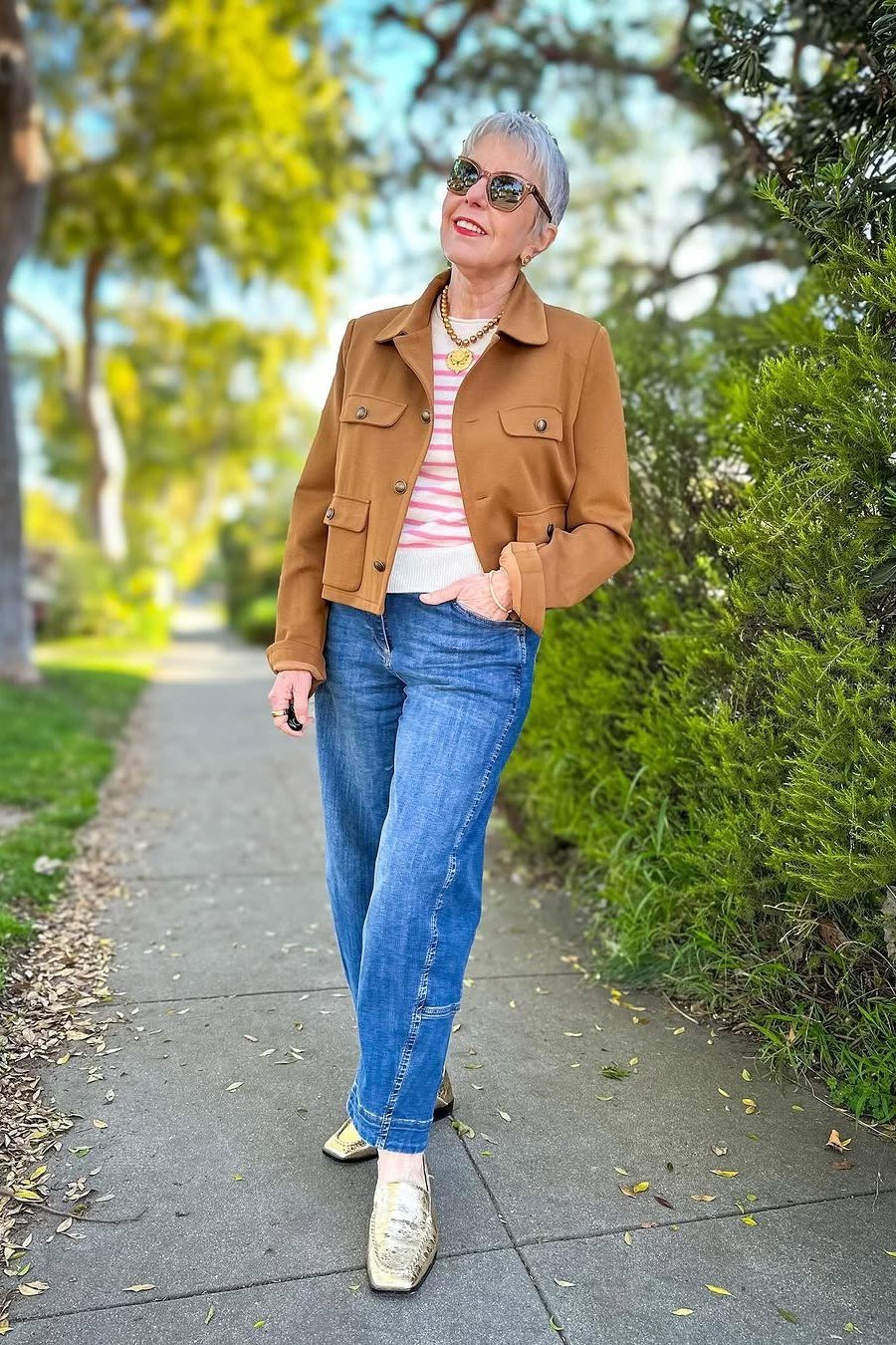 Tan suede trucker jacket with striped tee and blue jeans