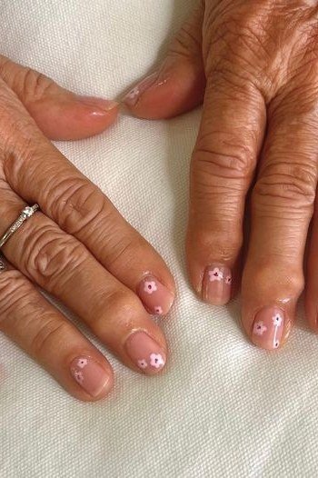 Sheer Pink with Tiny White Dots on Aged Hands - short nail design for women over 40
