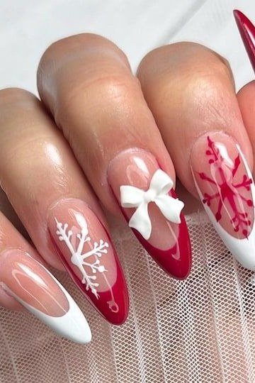 red and white christmas nails with snowflake and bow art