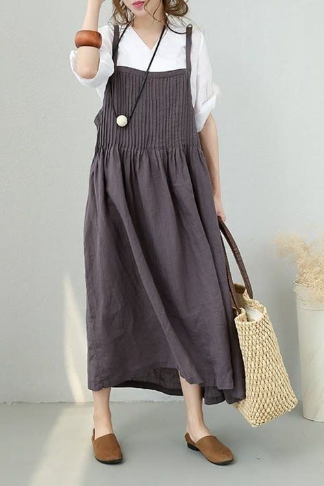 Charcoal pinafore midi over white tee with woven tote for women over 60