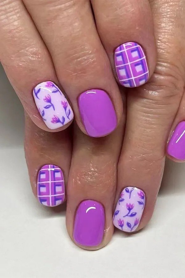 Bright purple nails with plaid floral accent nail art