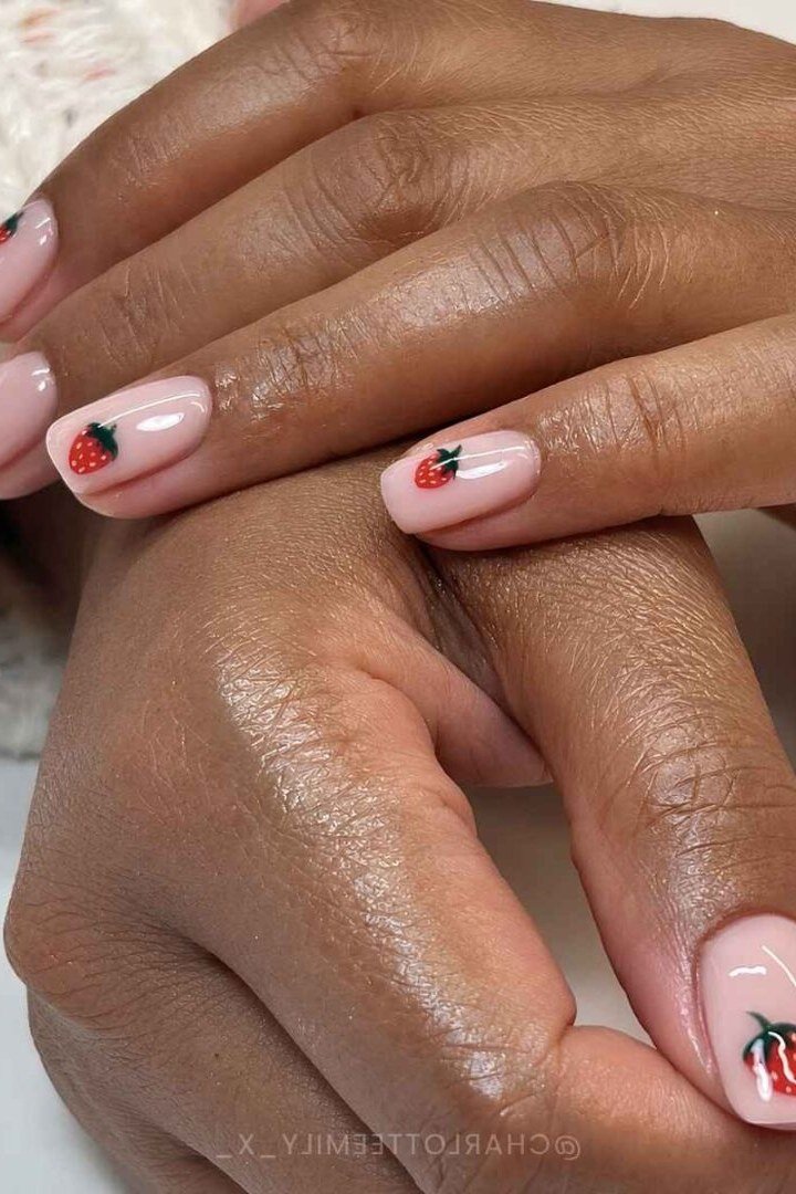 Sheer pink glaze nails with a strawberry accent nail