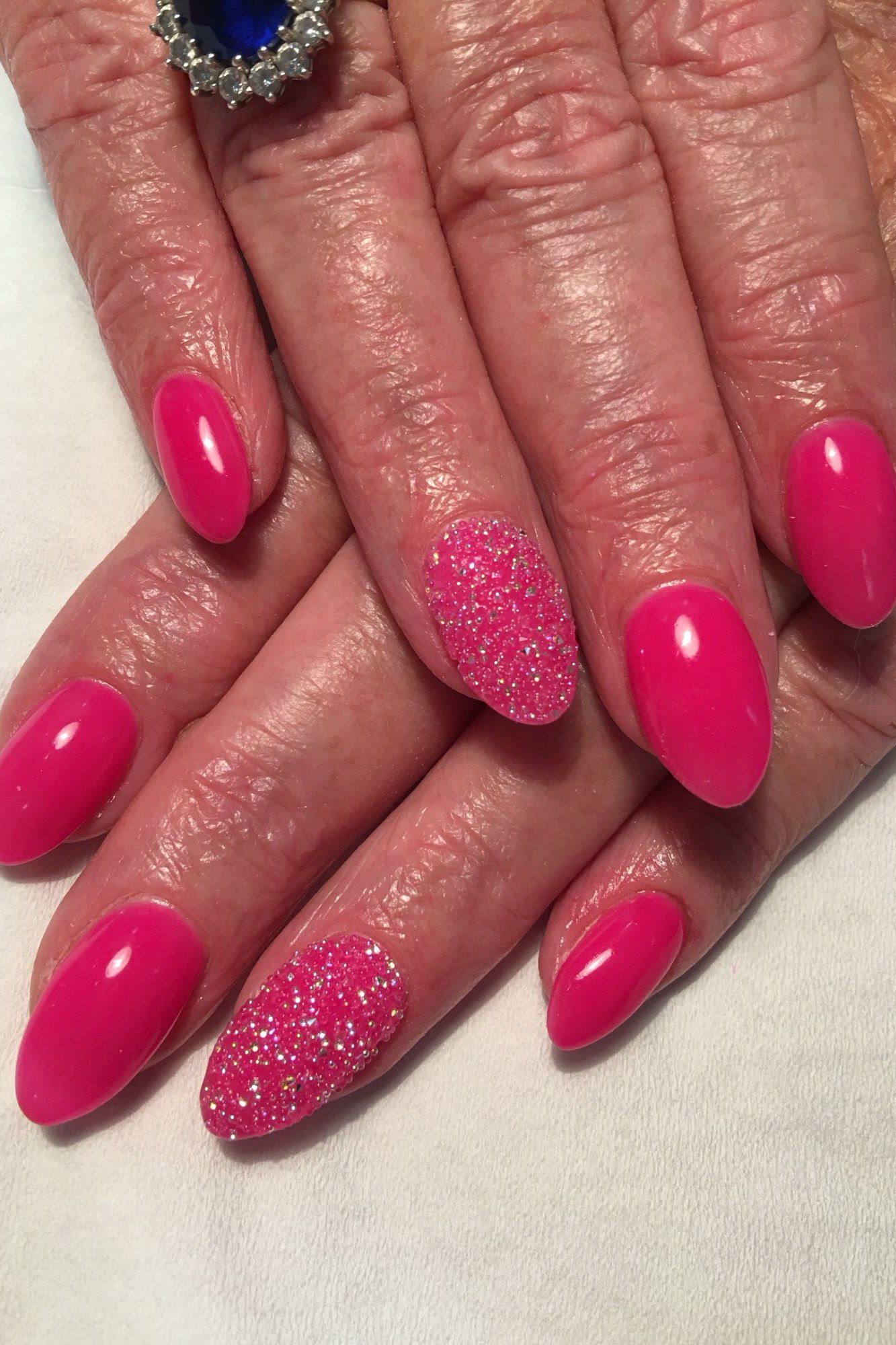 Hot pink nails with pink glitter accent nail