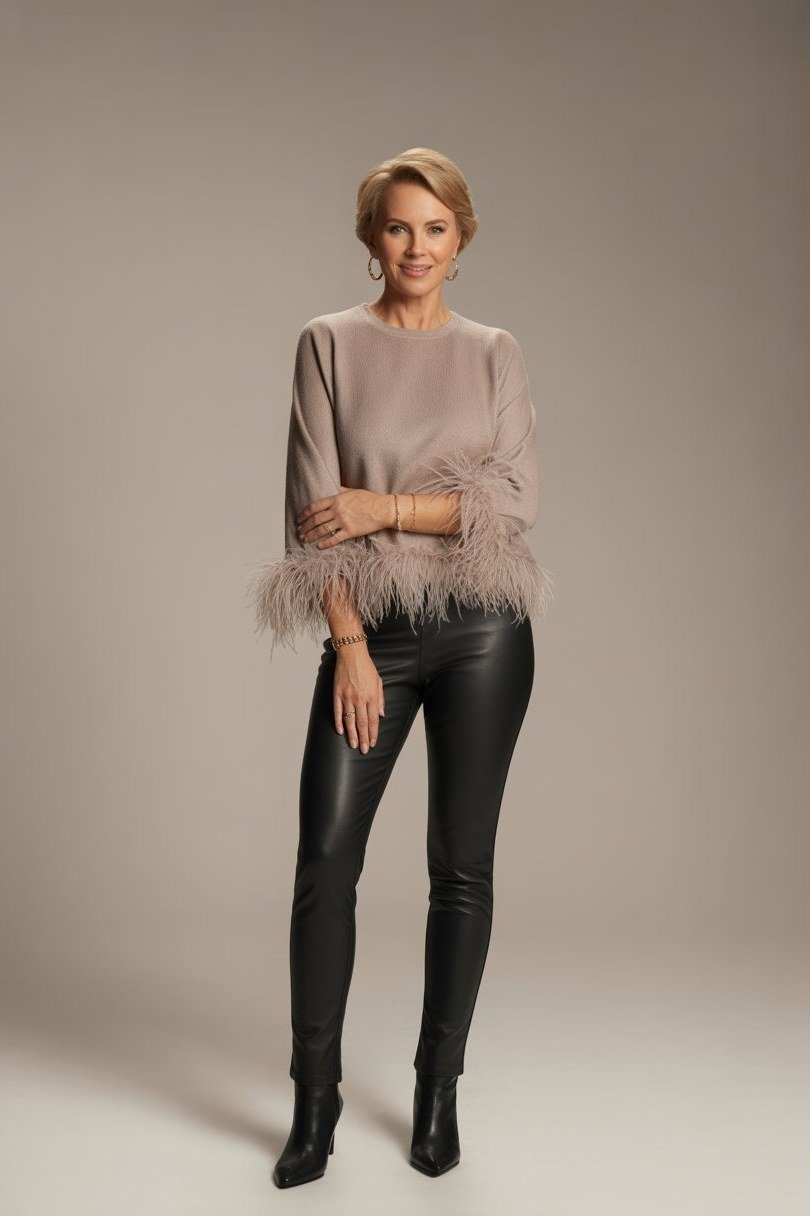 Feather-trim top with black leather pants for women over 50, fall date night outfit
