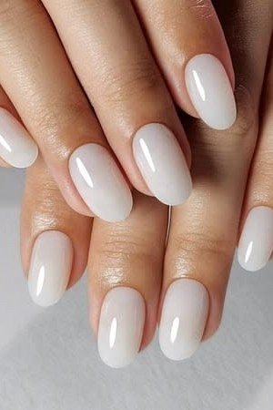 Milky white almond nails, sophisticated nail design for women over 50