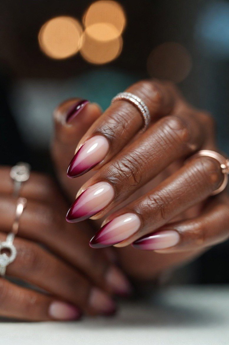 Burgundy ombre nails on deep skin tone for women over 50