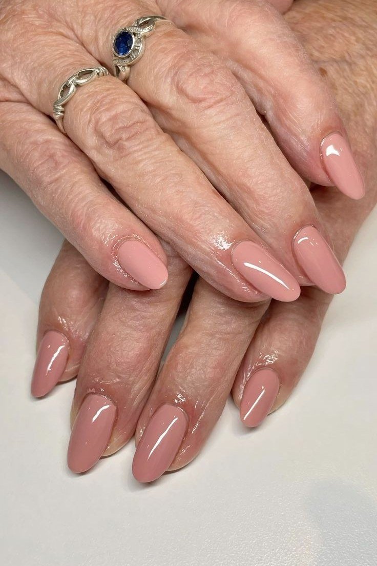 Glossy Nude on Aged Hands with Rings - short nail design for women over 40