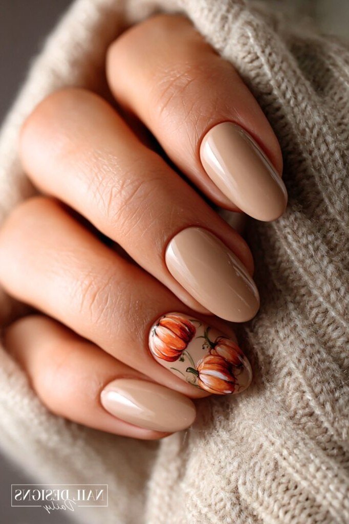 Beige with pumpkin art almond, elegant fall nail design for women over 40
