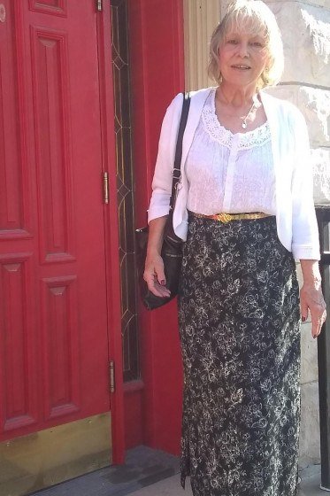 white cropped cardigan with black floral maxi skirt church outfit for women over 60