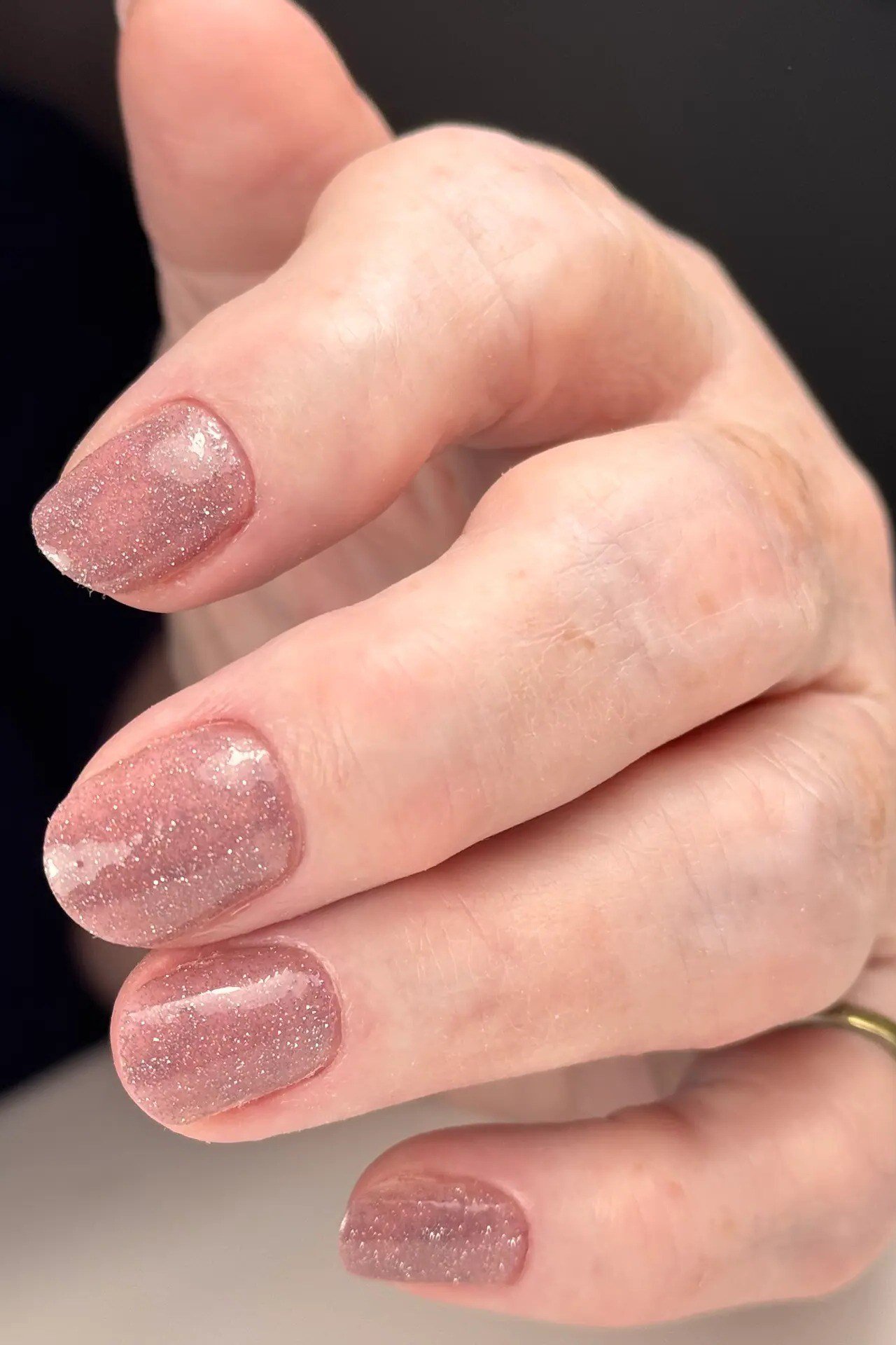 mauve shimmer oval gel nails with velvety finish, shimmer nail idea for mature hands
