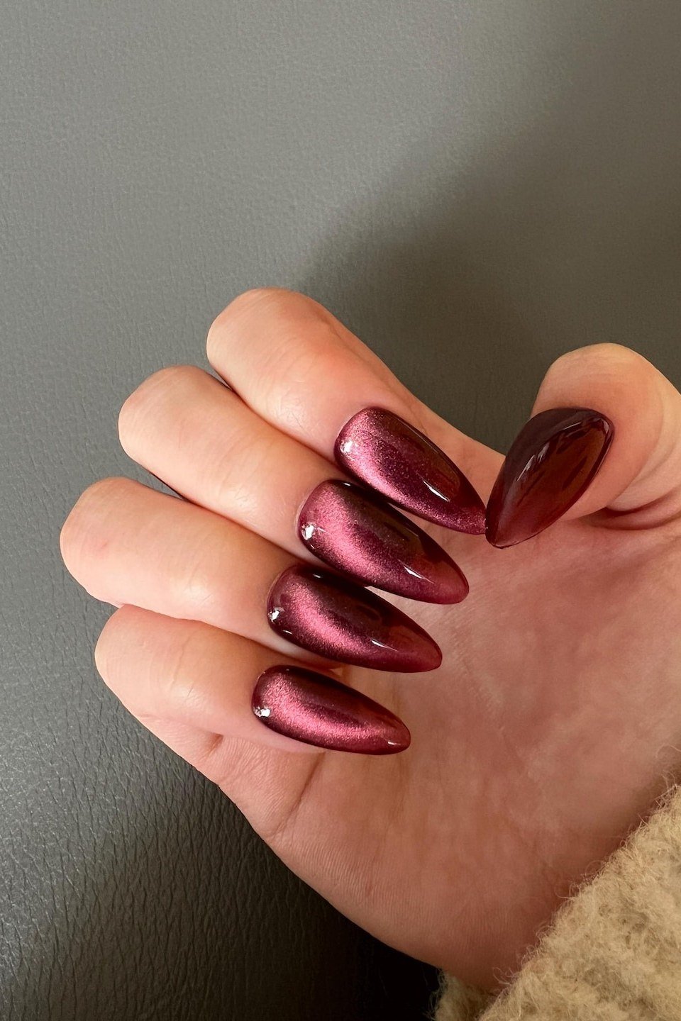 Cat-eye burgundy short, burgundy fall nail idea for women over 60