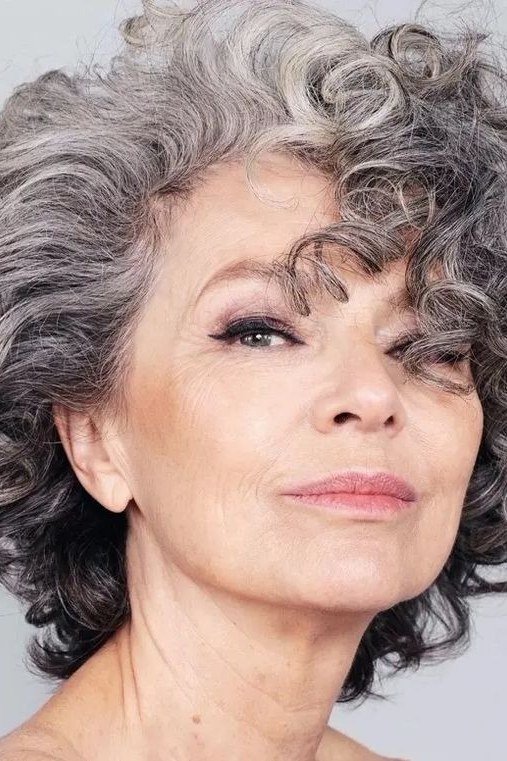 Salt-and-pepper curly bob front view - curly hairstyle for women over 60