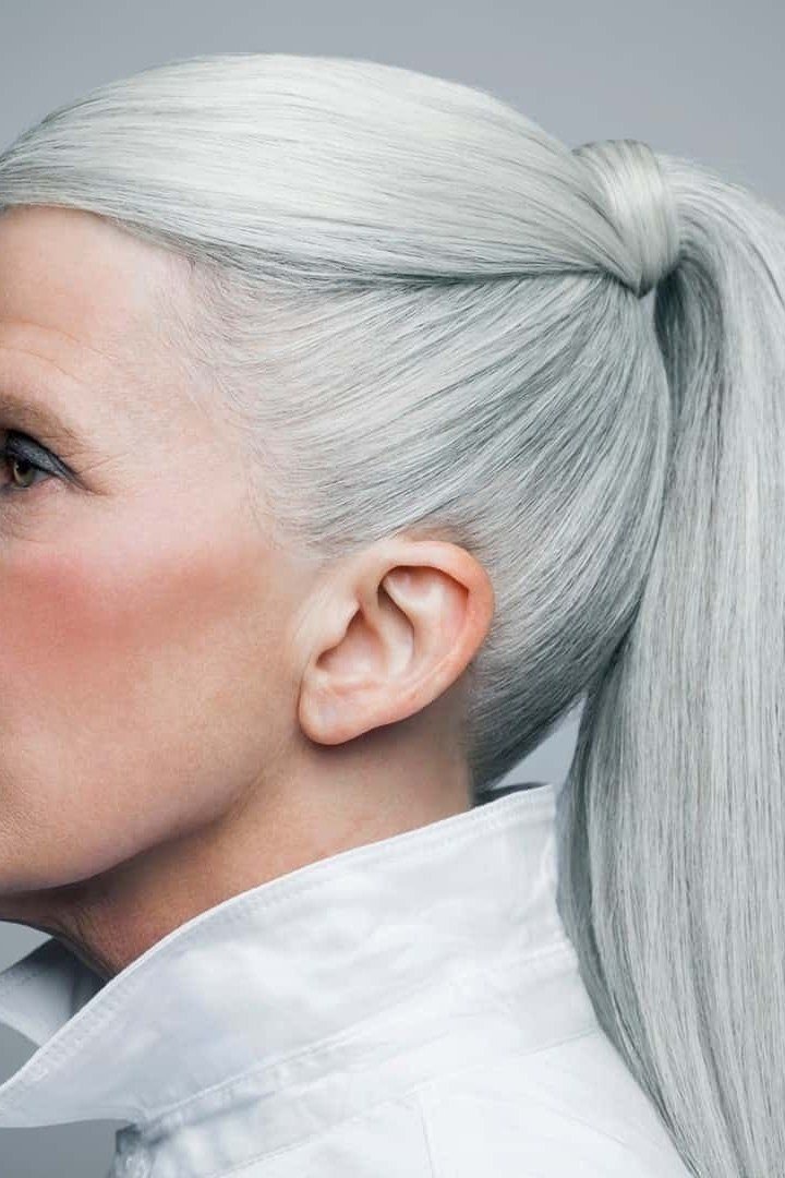 Very long silver sleek high ponytail for women over 50