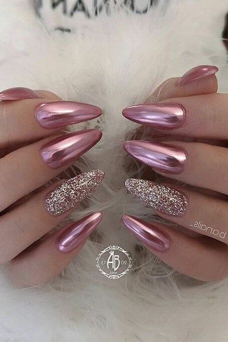 pink chrome stiletto nails with glitter accent nail
