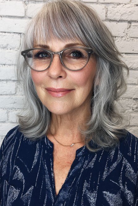 Gray medium cut with straight bangs and dark glasses for women over 60