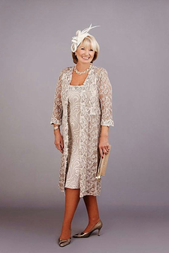 champagne lace dress with lace jacket and fascinator