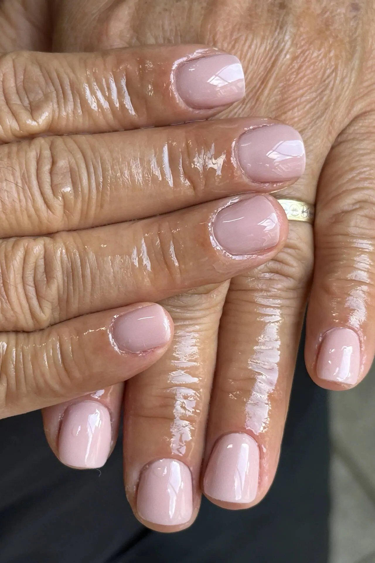 Barely there pink gel nails for mature hands