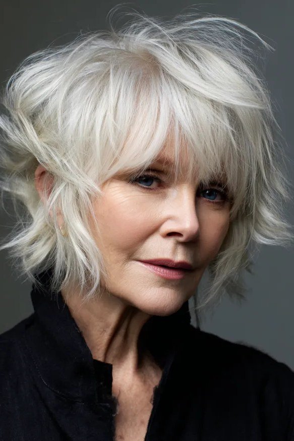 White shaggy bob with soft layers for women over 60, front view