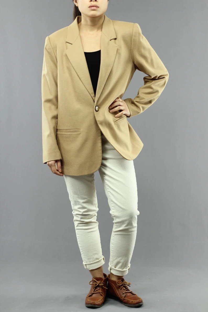 Golden yellow blazer with black top and white jeans for women over 60