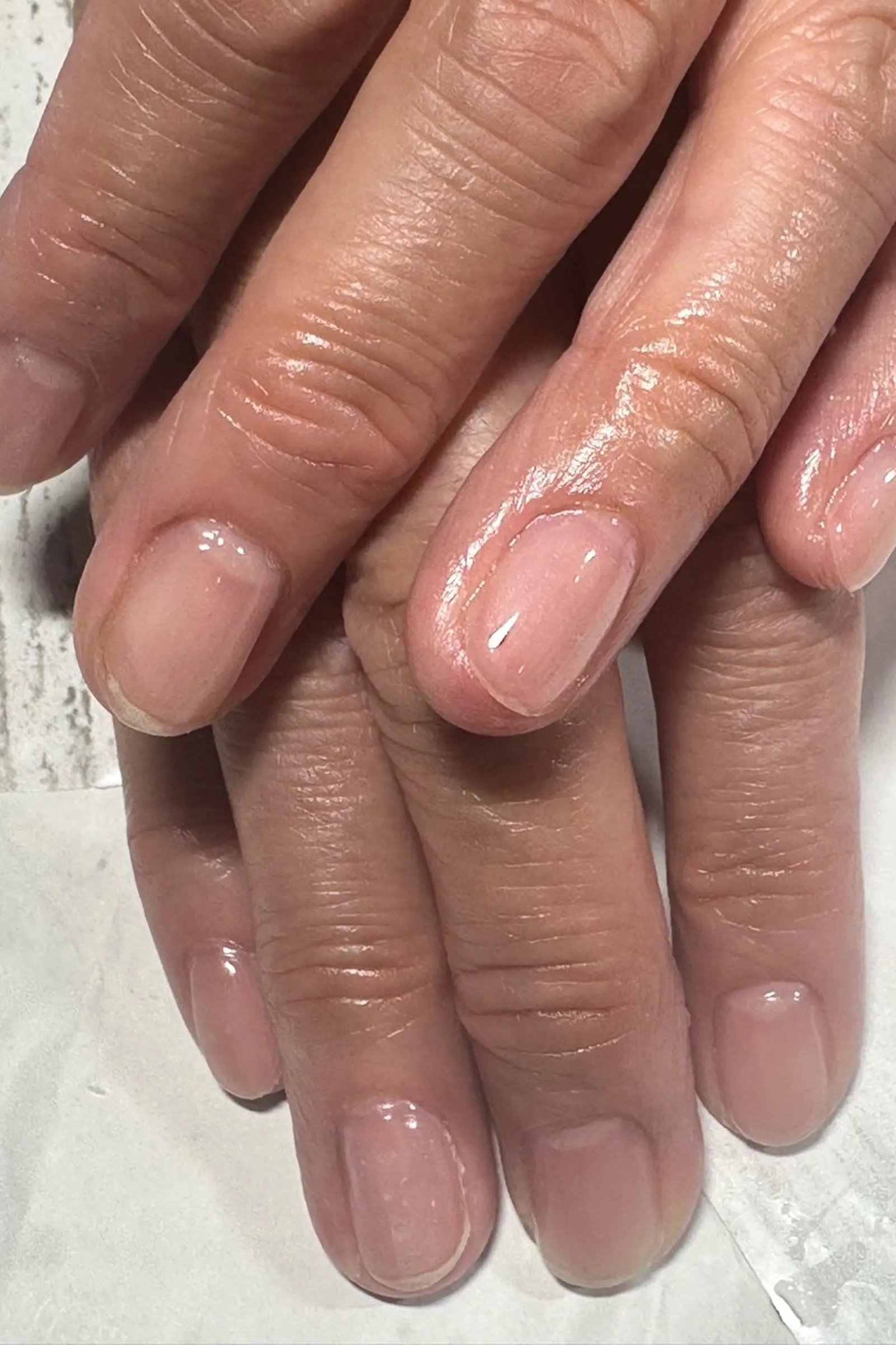 Simple Sheer Nude gel nails for women over 60