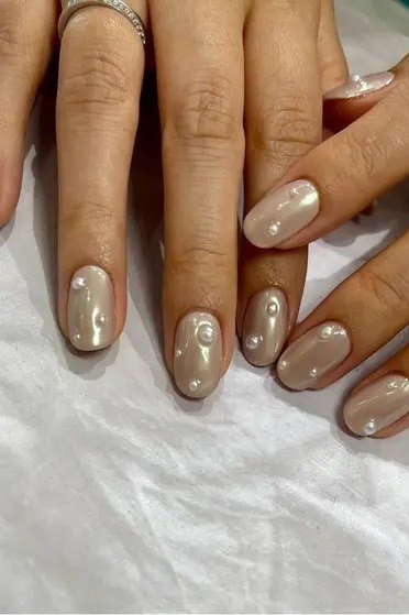 Champagne Nude Almond Nails - pearl finish nail idea for women over 60