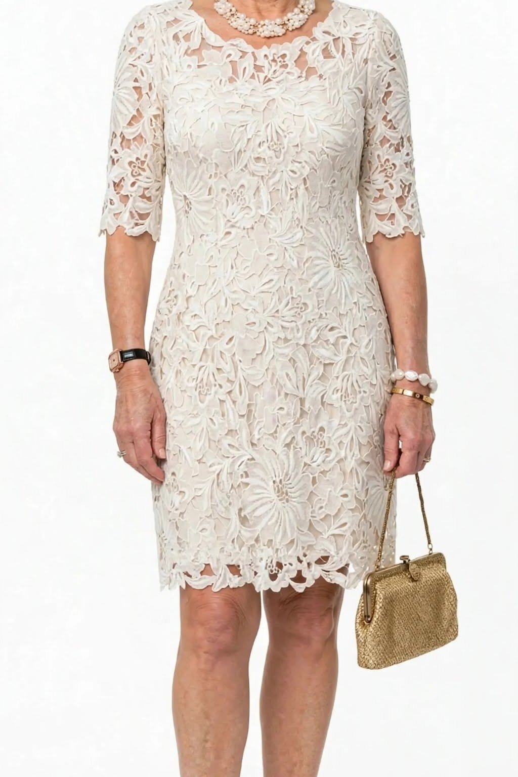 ivory lace cocktail dress with gold handbag
