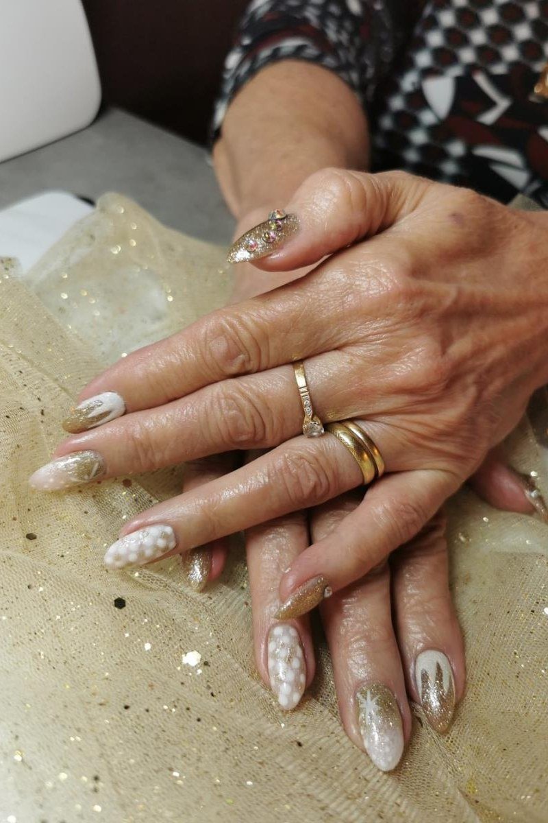 White nails with silver swirl art for older women