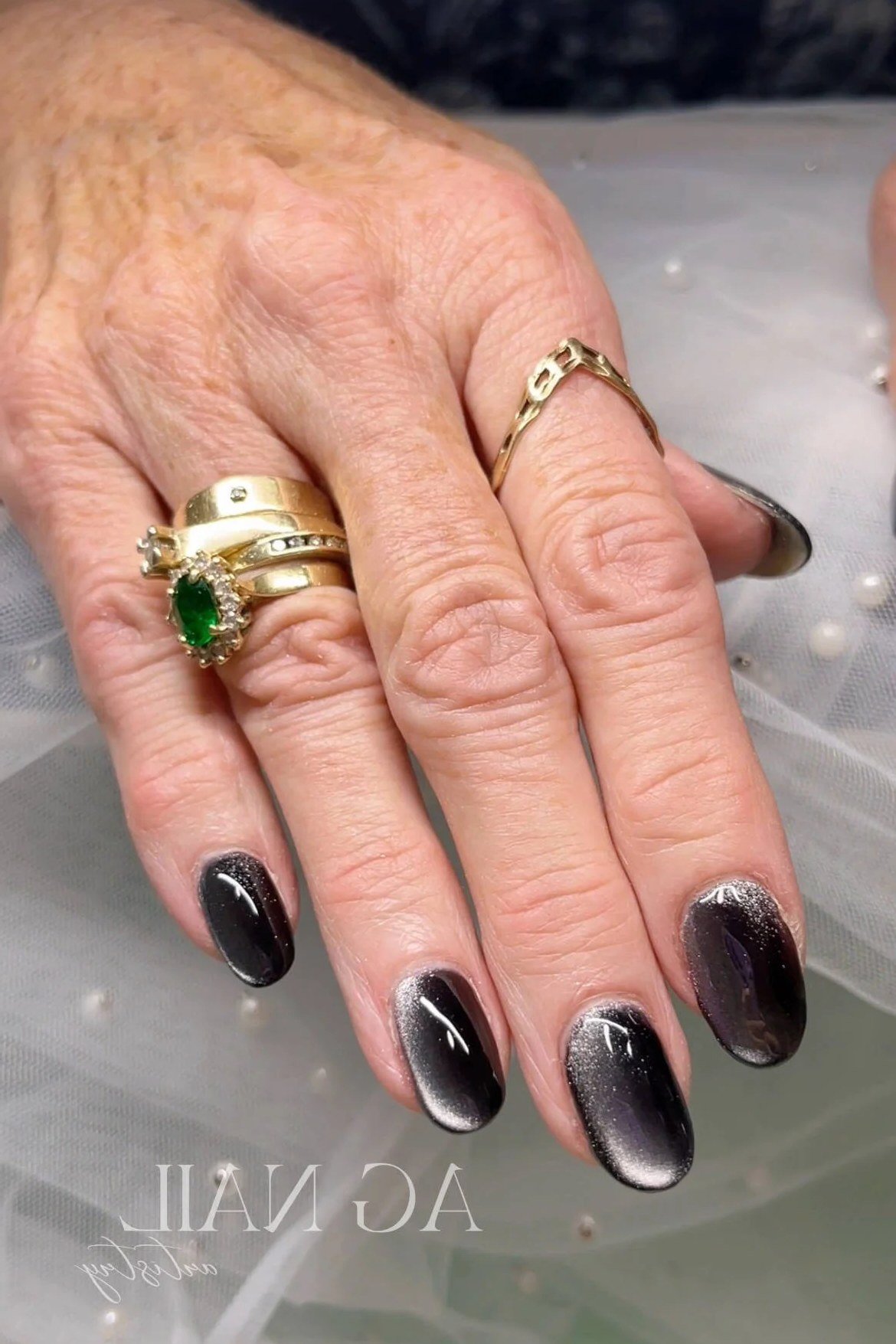 Dark Forest Cat Eye Nails - Deep forest green with black tones and magnetic shimmer covers these medium length almond nails.